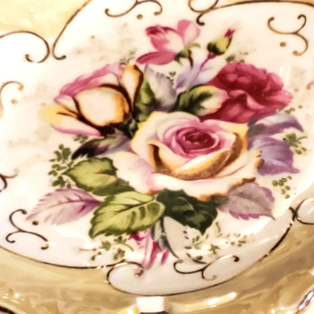 Vintage look iridescent plate with roses and cut out edges cream, pink